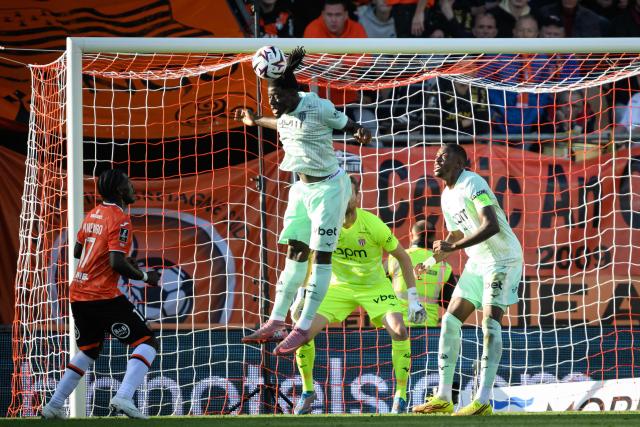 Monaco's Ghanaian defender #22 Mohammed Salisu heads the ball during the French L1 football match between FC Lorient and AS Monaco at the Stade du Moustoir in Lorient, western France, on October 18, 2026. (Photo by Loic VENANCE / AFP)