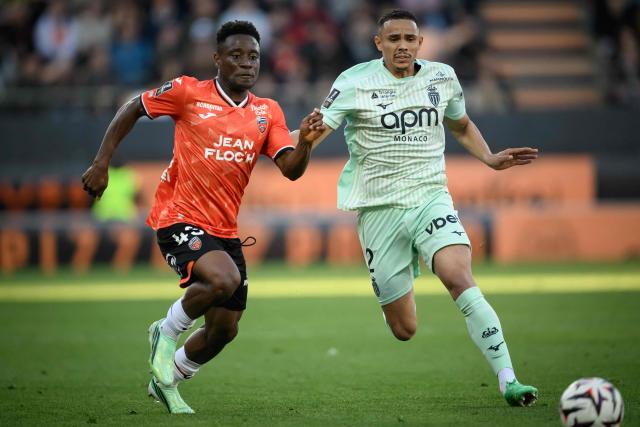 Lorient's Burkinabe defender #43 Arsene Kouassi (L) fights for the ball with Monaco's Brazilian defender #02 Vanderson during the French L1 football match between FC Lorient and AS Monaco at the Stade du Moustoir in Lorient, western France, on October 18, 2026. (Photo by Loic VENANCE / AFP)