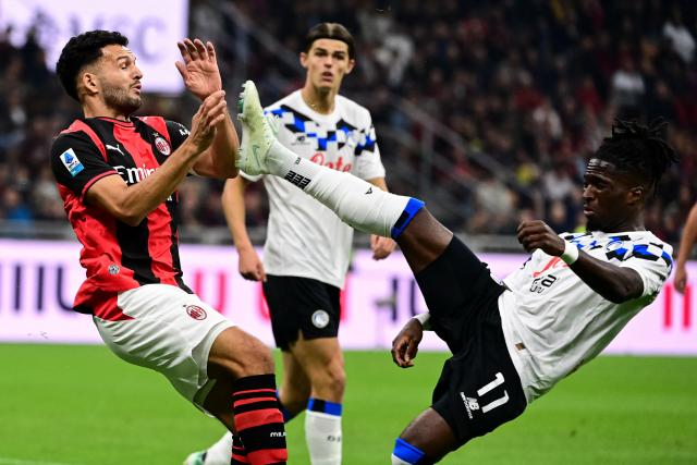 AC Milan's Portoguese forward #9 Gonçalo Ramos fights for the ball with Atalanta's English forward #11 Jonathan Rowe during the Italian Serie A football match between AC Milan and Atalanta at the San Siro Stadium in Milan, Italy on October 18, 2026. (Photo by Piero CRUCIATTI / AFP)