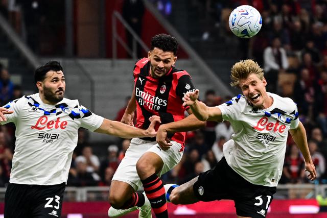 AC Milan's Portoguese forward #9 Gonçalo Ramos fights for the ball with Atalanta's Bosnian defender #23 Sead Kolasinac and Atalanta's Danish defender #31 Thomas Kristensen during the Italian Serie A football match between AC Milan and Atalanta at the San Siro Stadium in Milan, Italy on October 18, 2026. (Photo by Piero CRUCIATTI / AFP)