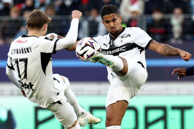 Rennes' French midfielder #10 Ludovic Blas (R) kicks the ball during the French L1 football match between Paris FC and Stade Rennais FC at Jean-Bouin Stadium in Paris on October 18, 2026. (Photo by FRANCK FIFE / AFP)