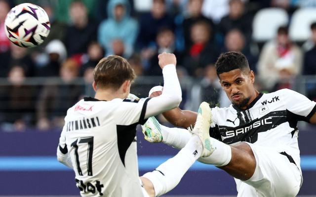 Rennes' French midfielder #10 Ludovic Blas (R) kicks the ball during the French L1 football match between Paris FC and Stade Rennais FC at Jean-Bouin Stadium in Paris on October 18, 2026. (Photo by FRANCK FIFE / AFP)