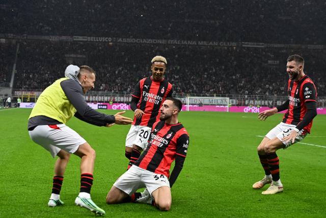 AC Milan's Spanish defender #34 Mario Gila (C-R) celebrates scoring his team's third goal during the Italian Serie A football match between AC Milan and Atalanta at the San Siro Stadium in Milan on October 18, 2026. (Photo by Piero CRUCIATTI / AFP)