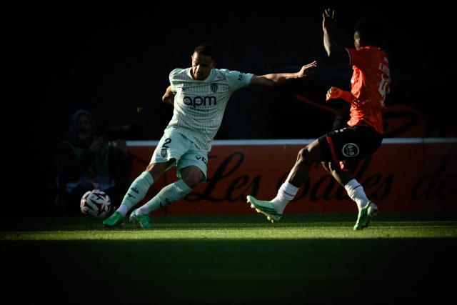 Monaco's Brazilian defender #02 Vanderson (L) fights for the ball with Lorient's Burkinabe defender #43 Arsene Kouassi during the French L1 football match between FC Lorient and AS Monaco at the Yves-Allainmat stadium in Lorient, Western France, on October 18, 2026. (Photo by Loic VENANCE / AFP)
