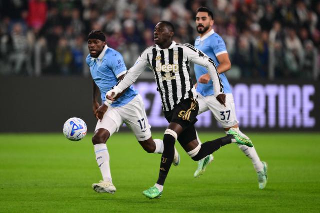 Juventus’ French forward #09 Randal Kolo Muani (C) fights for the ball with Lazio’s Portuguese defender #17 Nuno Tavares (L) during the Italian Serie A football match between Juventus and Lazio at the Allianz Stadium, in Turin on October 18, 2026. (Photo by Marco Bertorello / AFP)