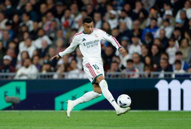 Real Madrid's French forward #10 Kylian Mbappe controls the ball during the Spanish league football match between Real Madrid CF and Sevilla FC at the Santiago Bernabeu stadium in Madrid on October 18, 2026. (Photo by Oscar DEL POZO / AFP)