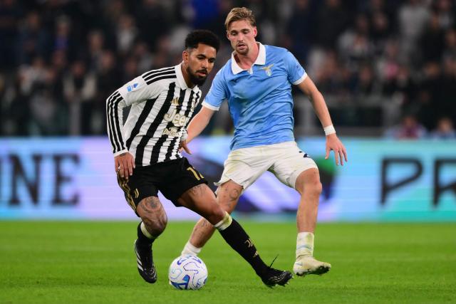Juventus’ Brazilian midfielder #12 Douglas Luiz (L) fights for the ball with Lazio’s Dutch midfielder #24 Kenneth Taylor during the Italian Serie A football match between Juventus and Lazio at the Allianz Stadium, in Turin on October 18, 2026. (Photo by Marco Bertorello / AFP)