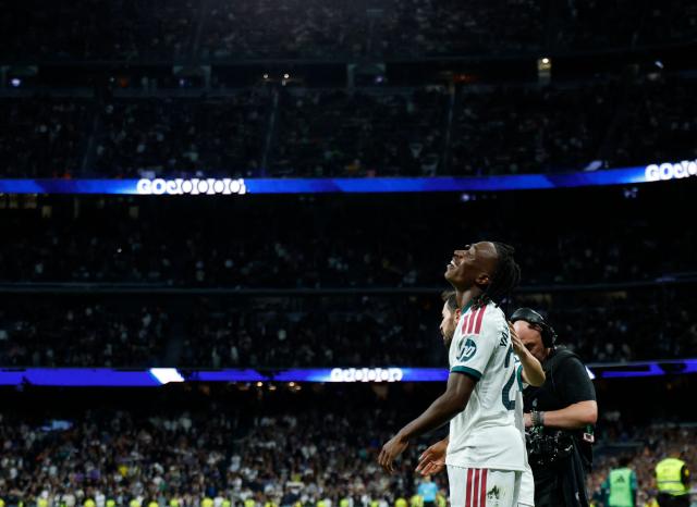 Real Madrid's Ivorian forward  #25 Yan Diomande celebrates scoring his team's fourth goal during the Spanish league football match between Real Madrid CF and Sevilla FC at the Santiago Bernabeu stadium in Madrid on October 18, 2026. (Photo by Oscar DEL POZO / AFP)