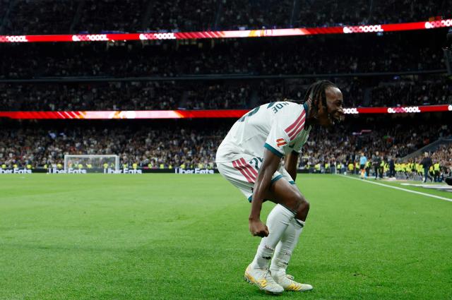 Real Madrid's Ivorian forward  #25 Yan Diomande celebrates scoring his team's fourth goal during the Spanish league football match between Real Madrid CF and Sevilla FC at the Santiago Bernabeu stadium in Madrid on October 18, 2026. (Photo by Oscar DEL POZO / AFP)