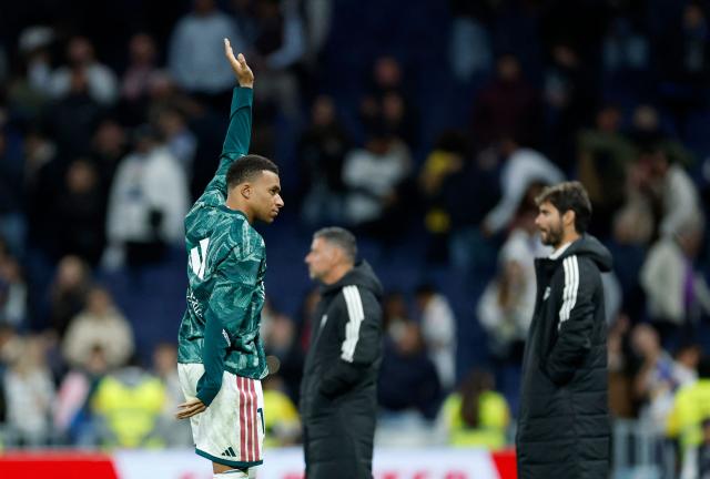 Real Madrid's French forward #10 Kylian Mbappe waves at the end of the Spanish league football match between Real Madrid CF and Sevilla FC at the Santiago Bernabeu stadium in Madrid on October 18, 2026. Real Madrid won 4-1. (Photo by Oscar DEL POZO / AFP)
