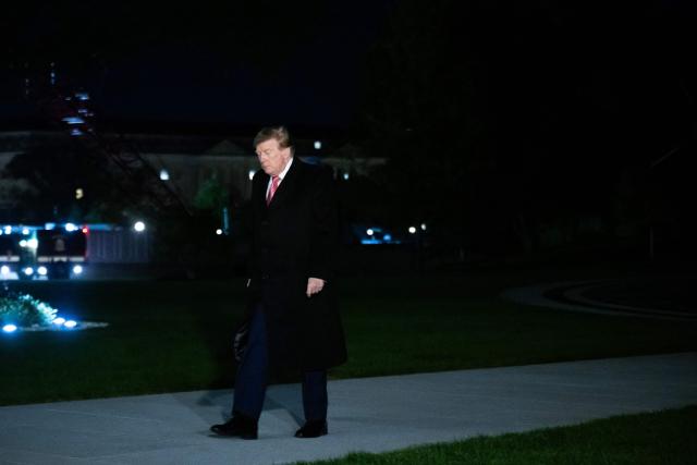 US President Donald Trump walks across the South Lawn after arriving on Marine One at the White House in Washington, DC, on October 18, 2026. President Trump is returning to Washington, DC, after campaigning in Georgia and Kentucky over the weekend. (Photo by SAUL LOEB / AFP)