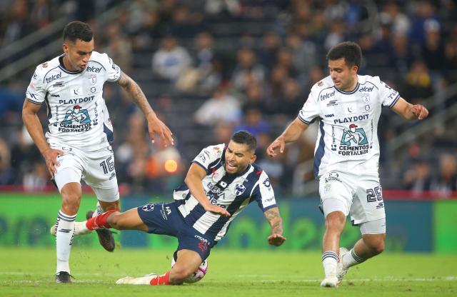 Monterrey's midfielder #25 Orbelin Pineda (C), Pachuca's Colombian midfielder #16 Christian Rivera and midfielder #26 Alan Bautista fight for the ball during the Liga MX Apertura tournament football match between Cruz Azul and Juarez at the BBVA stadium in Guadalupe, Nuevo Leon state, Mexico, on October 18, 2026. (Photo by Julio Cesar Aguilar / AFP)