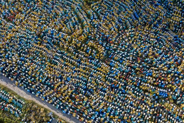 A large number of electric scooters, abandoned or unused, are piled up in an open area in Yuecheng District, Shaoxing, in eastern China's Zhejiang province, on October 17, 2026. (Photo by CN-STR / AFP) / China OUT