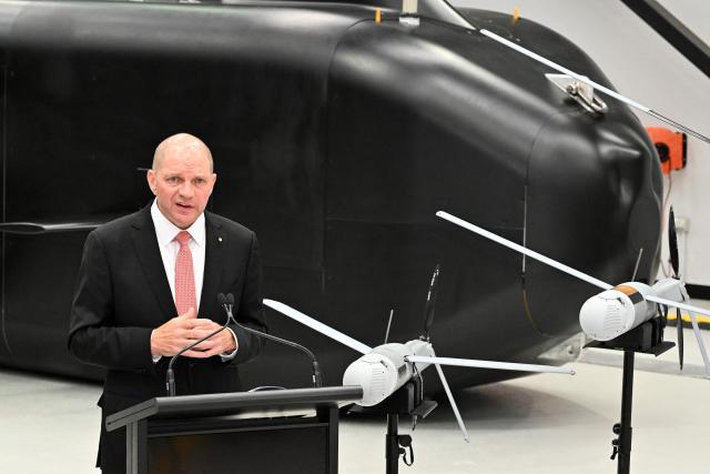 Anduril Australia & Asia Pacific CEO and Executive Chairman David Goodrich speaks to the media in front of the Ghost Shark autonomous undersea vehicle at an Anduril facility in Sydney on October 19, 2026, during the unveiling of three new autonomous systems capabilities under AUKUS Pillar II. (Photo by Saeed KHAN / AFP)