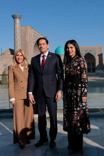 US Secretary of State Marco Rubio (C) and his wife Jeanette Dousdebes Rubio (L), and Head of the Presidential Administration of Uzbekistan Saida Mirziyoyeva pose for a photograph at Registan Square in Samarkand, Uzbekistan, on October 19, 2026. (Photo by Kylie Cooper / POOL / AFP)