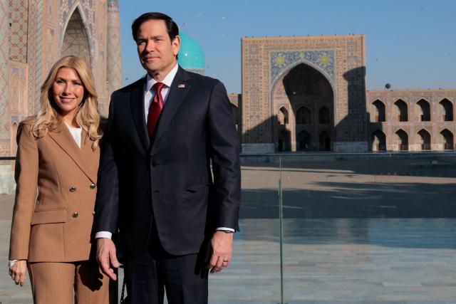 US Secretary of State Marco Rubio and his wife Jeanette Dousdebes Rubio pose for a photograph at Registan Square in Samarkand, Uzbekistan, on October 19, 2026. (Photo by Kylie Cooper / POOL / AFP)