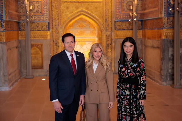 US Secretary of State Marco Rubio and his wife Jeanette Dousdebes Rubio (C), and Head of the Presidential Administration of Uzbekistan Saida Mirziyoyeva pose for a photograph at Registan Square in Samarkand, Uzbekistan, on October 19, 2026. (Photo by Kylie Cooper / POOL / AFP)
