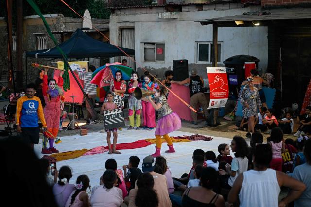 Members of the TET Center for Artistic Creation perform during the 6th Social Festival of Performing Arts in Playa Verde, Catia La Mar, La Guaira state, Venezuela, on October 18, 2026. The TET Center for Artistic Creation perform for survivors of two June 24, 2026, devastating earthquakes which killed more than 6,500 people. (Photo by Federico PARRA / AFP)