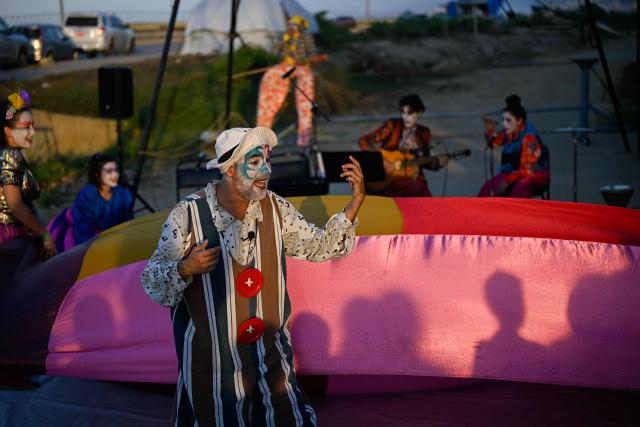 Members of the TET Center for Artistic Creation perform during the 6th Social Festival of Performing Arts in Playa Verde, Catia La Mar, La Guaira state, Venezuela, on October 18, 2026. The TET Center for Artistic Creation perform for survivors of two June 24, 2026, devastating earthquakes which killed more than 6,500 people. (Photo by Federico PARRA / AFP)