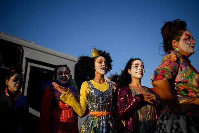 Members of the TET Center for Artistic Creation take a part during the 6th Social Festival of Performing Arts in Playa Verde, Catia La Mar, La Guaira state, Venezuela, on October 18, 2026. The TET Center for Artistic Creation perform for survivors of two June 24, 2026, devastating earthquakes which killed more than 6,500 people. (Photo by Federico PARRA / AFP)