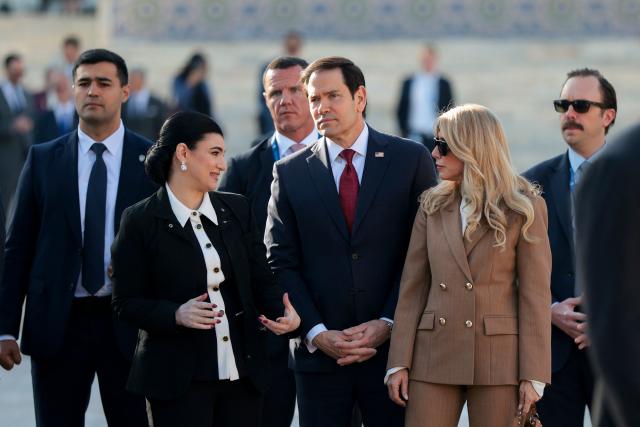 US Secretary of State Marco Rubio (C) and his wife Jeanette Dousdebes Rubio (2nd R) tour Registan Square in Samarkand, Uzbekistan, on October 19, 2026. (Photo by Kylie Cooper / POOL / AFP)