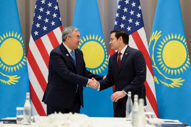 US Secretary of State Marco Rubio (L) meets with Kazakhstan's Foreign Minister Mukhtar Tileuberdi at the Congress Center in Samarkand, Uzbekistan, on October 19, 2026. (Photo by Kylie Cooper / POOL / AFP)