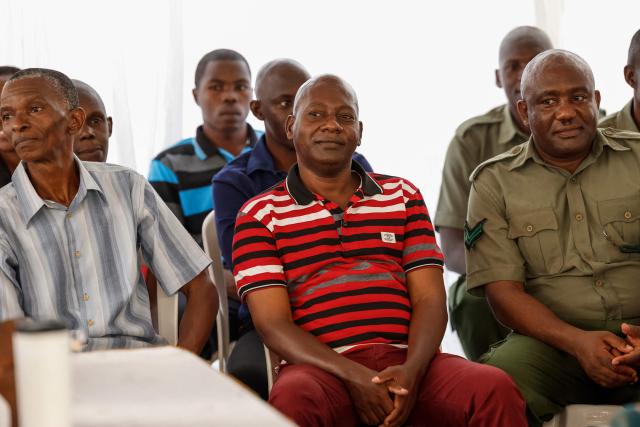 Self-proclaimed pastor Paul Mackenzie (C) looks on during his court appearance at the Mombasa Law Court in Mombasa on October 19, 2026. A Mombasa court will deliver a long-awaited verdict on October 19 in the trial of a self-proclaimed Kenyan preacher and his associates, accused of murdering 191 people, mostly children, in an infamous starvation cult. Hundreds of bodies were discovered in 2023 inland from the Kenyan beach resort of Malindi, in what became known as the "Shakahola Forest Massacre". One of the world's worst cult-related tragedies made global headlines. (Photo by SIMON MAINA / AFP)