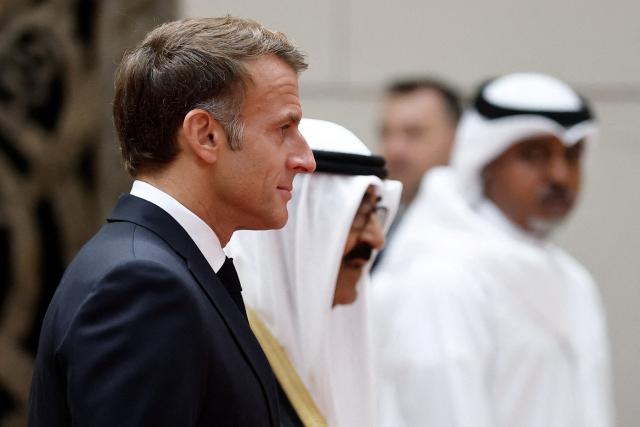 French President Emmanuel Macron is welcomed by the Emir of Kuwait upon his arrival at Kuwait International Airport, in Kuwait City October 19, 2026. (Photo by Benoit Tessier / POOL / AFP)
