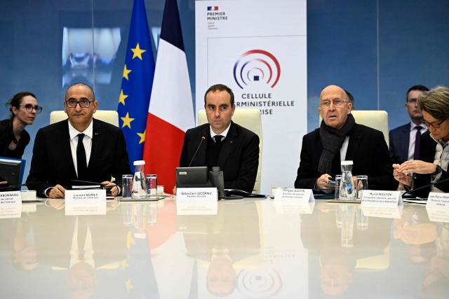 (From L) France's Interior Minister Laurent Nunez, France's Prime Minister Sebastien Lecornu, Chief of Staff to France's Prime Minister Philippe Gustin and Prefect of the Loire department Muriel Nguyen arrive for an Interministerial Crisis Meeting at the Interior Ministry in Paris on October 19, 2026, two days after riots and looting on the sidelines of nationwide protests against the "high cost of living". (Photo by JULIEN DE ROSA / POOL / AFP)