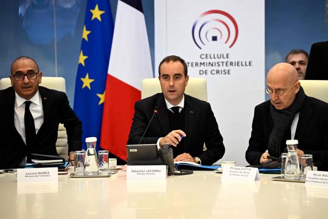 (From L) France's Interior Minister Laurent Nunez, France's Prime Minister Sebastien Lecornu and Chief of Staff to France's Prime Minister Philippe Gustin arrive for an Interministerial Crisis Meeting at the Interior Ministry in Paris on October 19, 2026, two days after riots and looting on the sidelines of nationwide protests against the "high cost of living". (Photo by JULIEN DE ROSA / POOL / AFP)