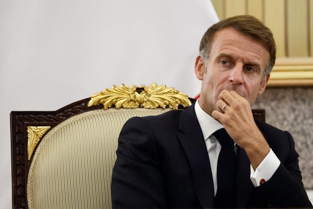 French President Emmanuel Macron attends an agreement-signing ceremony with the Emir of Kuwait at the Bayan Palace, in Kuwait City on October 19, 2026. The French president arrived in Kuwait on October 19, beginning a tour of four Gulf countries, Kuwait, UAE, Bahrain and Qatar. (Photo by Benoit Tessier / POOL / AFP)