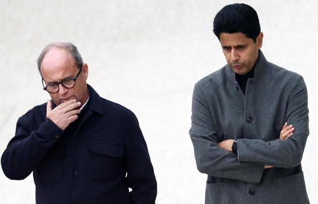 Paris Saint Germain's Portuguese Football Advisor Luis Campos (L) speaks with Paris Saint-Germain's Qatari president Nasser Al-Khelaïfi  on the sidelines of a training session at the Campus Paris Saint-Germain in Poissy, on October 19, 2026, on the eve of the UEFA Champions League first round day 3 football match against Barcelona. (Photo by FRANCK FIFE / AFP)