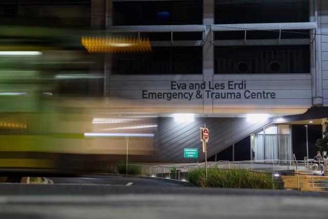 A view of The Alfred hospital, where Australian independent lawmaker Helen Haines was airlifted to for treatment following critical injuries after being struck by a car outside her office in Wangaratta, is seen in Melbourne late on October 19, 2026. Haines was being treated in hospital for critical injuries on October 19 after being struck deliberately by a car in what officials described as a "violent" attack. (Photo by Martin KEEP / AFP)