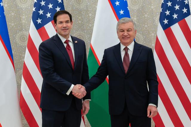 US Secretary of State Marco Rubio (L) and Uzbekistan's President Shavkat Mirziyoyev shake hands ahead of their meeting at the Congress Center in Samarkand on October 19, 2026. (Photo by Kylie Cooper / POOL / AFP)
