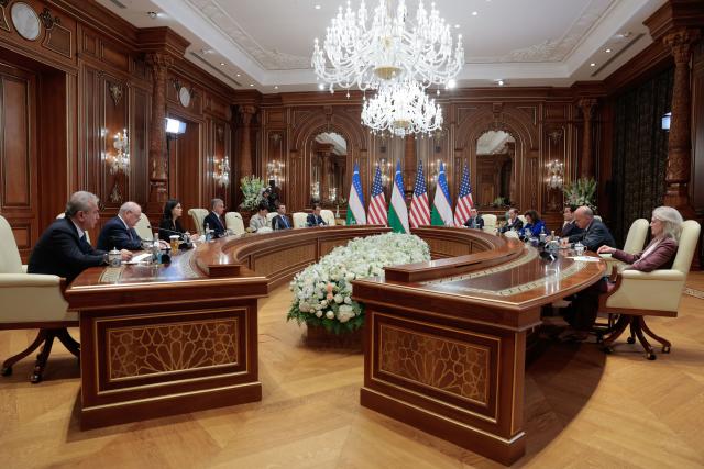 US Secretary of State Marco Rubio (3rd R) meets with Uzbekistan's President Shavkat Mirziyoyev (4th L) at the Congress Center in Samarkand on October 19, 2026. (Photo by Kylie Cooper / POOL / AFP)