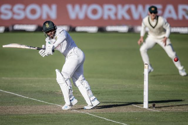 South Africa's Temba Bavuma watches the ball after playing a shot on day two of the second Test match between South Africa and Australia at St Georges Park in Gqeberha on October 19, 2026. (Photo by Marco Longari / AFP)