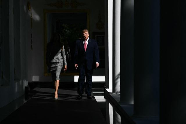 US President Donald Trump and First Lady Melania Trump arrive for an executive order signing ceremony in the Rose Garden of the White House in Washington, DC, on October 19, 2026. The executive order aims to a create a Women’s Health Division at the National Institutes of Health (NIH) and a White House Women’s Health Task Force. (Photo by Brendan SMIALOWSKI / AFP)