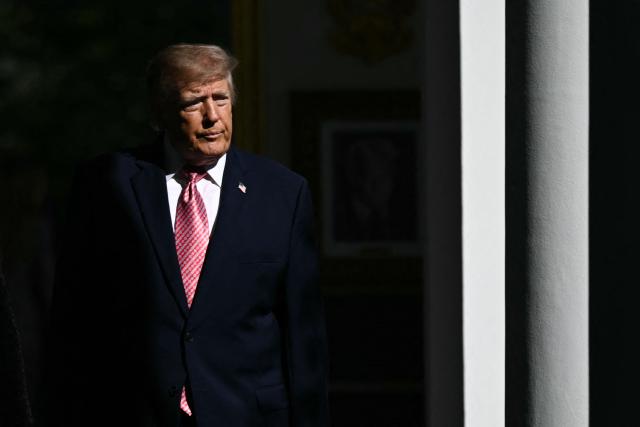 US President Donald Trump arrives for an executive order signing ceremony in the Rose Garden of the White House in Washington, DC, on October 19, 2026. The executive order aims to a create a Women’s Health Division at the National Institutes of Health (NIH) and a White House Women’s Health Task Force. (Photo by Brendan SMIALOWSKI / AFP)