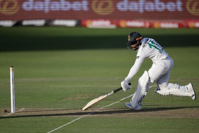 South Africa's Temba Bavuma runs to safety on day two of the second Test match between South Africa and Australia at St Georges Park in Gqeberha on October 19, 2026. (Photo by Marco Longari / AFP)