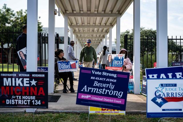 People arrive and depart a polling location on the first day of early voting in Texas for the midterm elections, at the West Gray Metropolitan Multiservice Center in Houston, Texas, on October 19, 2026. Democrat James Talarico is facing Republican and Texas Attorney General Ken Paxton in a race for one of Texas's US Senate seats. No Democrat has won statewide office in the conservative southern state since 1994, and Trump carried Texas by nearly 14 percentage points in the 2024 presidential election. (Photo by RONALDO SCHEMIDT / AFP)