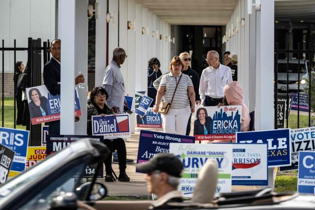 People arrive and depart a polling location on the first day of early voting in Texas for the midterm elections, at the West Gray Metropolitan Multiservice Center in Houston, Texas, on October 19, 2026. Democrat James Talarico is facing Republican and Texas Attorney General Ken Paxton in a race for one of Texas's US Senate seats. No Democrat has won statewide office in the conservative southern state since 1994, and Trump carried Texas by nearly 14 percentage points in the 2024 presidential election. (Photo by RONALDO SCHEMIDT / AFP)