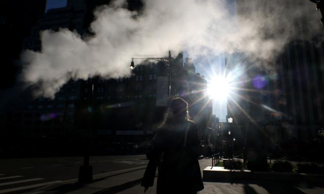 Steam rises from a pipe on Central Park South as New Yorkers wake to clear skies and temperatures around 48 degrees in New York City October 19, 2026. (Photo by TIMOTHY A. CLARY / AFP)
