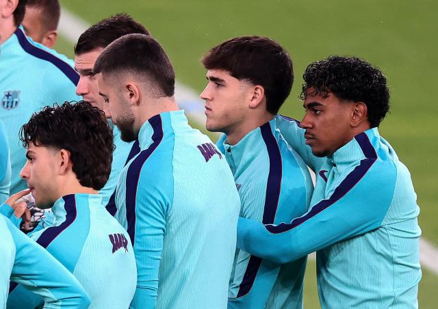 Barcelona's Spanish forward Lamine Yamal (R) reacts with teammates during a training session at the Parc des Princes stadium in Paris on October 19, 2026, on the eve of the UEFA Champions League first round day 3 football match between Paris Saint Germain (PSG) and FC Barcelona. (Photo by FRANCK FIFE / AFP)