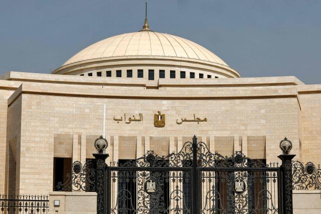 (FILES) The exterior of the new headquarters for the House of Representatives, the lower house of the Egyptian Parliament, is pictured at the New Administrative Capital megaproject about 45 kilometres east of the current capital Cairo on August 1, 2023. Egypt's parliament on October 19, 2026 delayed a debate on President Abdel Fattah al-Sisi's request to authorise military support for Saudi Arabia until next week, state media reported, after an emergency session ended without a decision a day earlier. (Photo by Khaled DESOUKI / AFP)
