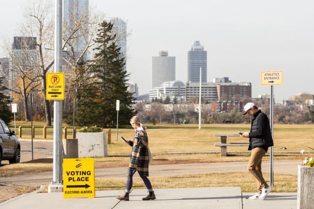 People depart a polling location after voting on a referendum to decide if Albertans want to begin the process of separating from Canada, in Edmonton, Alberta, Canada, on October 19, 2026. Alberta votes today to determine if it wants to pursue a binding referendum on leaving Canada, with Prime Minister Mark Carney warning a separatist win would bring dangerous uncertainty during a trade war with the United States. Polls indicate less than a quarter of people in the western Canadian province support independence. (Photo by Megan Albu / AFP)