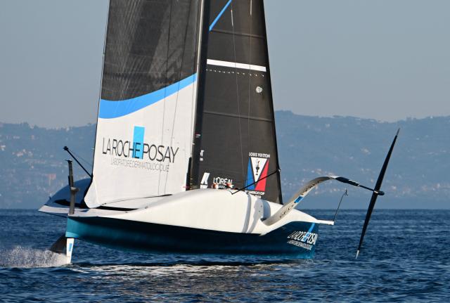 The AC75 boat of the La Roche Posay Team Racing sails off Naples after its launch during a press presentation ahead of the 2027 America's Cup, on October 19, 2026. (Photo by Stefano RELLANDINI / AFP)