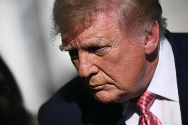 US President Donald Trump speaks to the media before boarding Marine One on the South Lawn of the White House in Washington, DC, on October 19, 2026. President Trump is traveling to Wichita, Kansas to hold a campaign rally ahead of the midterm elections. (Photo by Brendan SMIALOWSKI / AFP)