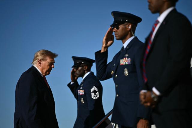 US President Donald Trump boards Air Force One at Joint Base Andrews, Maryland on October 19, 2026. President Trump is traveling to Wichita, Kansas to hold a campaign rally ahead of the midterm elections. (Photo by Kent NISHIMURA / AFP)