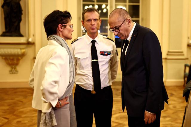 France's Interior Minister Laurent Nunez (R), deputy Prefect to the Prefect of Police of Bouches-du-Rhone Corinne Simon (L) and Prefect of the Provence-Alpes Cote d'Azur region Jacques Witkowski (C) speak at the Mayor's office in the aftermath of two days of riots and looting on the sidelines of nationwide protests against the "high cost of living", in Marseille, south-eastern France on October 19, 2026. (Photo by Thibaud MORITZ / AFP)
