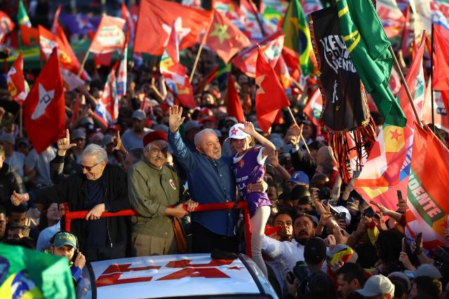 Brazil's President and presidential candidate Luiz Inacio Lula da Silva of the Workers' Party (PT) holds a child during a rally in Porto Alegre, Rio Grande do Sul state, Brazil, on October 19, 2026, ahead of the presidential runoff election. (Photo by SILVIO AVILA / AFP)